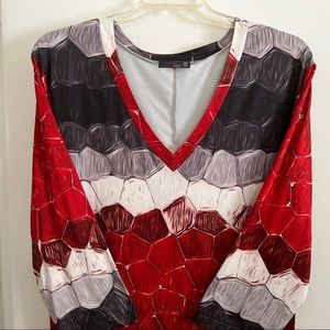 Super cute Vneck 3/4 sleeve perfection. Smooth, well made Colorful top or dress